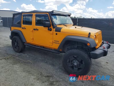 Czwarte zdjęcie samochodu z boku: 2012 JEEP WRANGLER UNLIMITED SPORT VIN:1C4BJWDG7CL120428 - miniatura