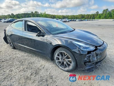 Czwarte zdjęcie samochodu z boku: 2022 TESLA MODEL 3 VIN:5YJ3E1EB9NF202472 - miniatura