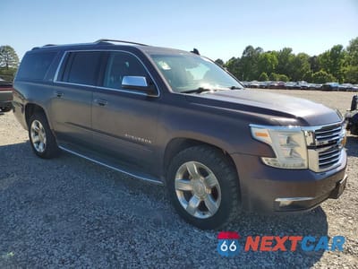 Czwarte zdjęcie samochodu z boku: 2015 CHEVROLET SUBURBAN K1500 LTZ VIN:1GNSKKKC5FR636804 - miniatura