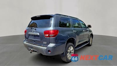 Czwarte zdjęcie samochodu z boku: 2010 TOYOTA SEQUOIA PLATINUM VIN:5TDDY5G18AS033686 - miniatura