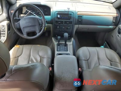 Zdjęcie 8 z 13 samochodu: 1999 JEEP GRAND CHEROKEE LAREDO VIN:1J4GW58S6XC569065 - miniatura