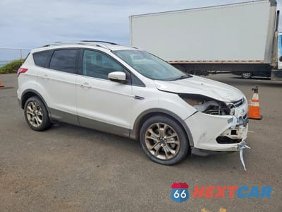 Czwarte zdjęcie samochodu z boku: 2014 FORD ESCAPE TITANIUM VIN:1FMCU0J98EUC15815 - miniatura