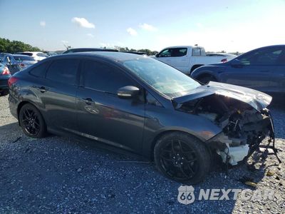 Czwarte zdjęcie samochodu z boku: 2016 FORD FOCUS VIN:1FADP3F24GL236463 - miniatura