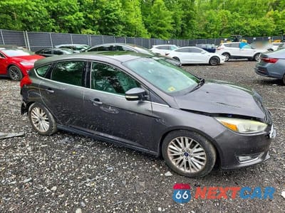 Czwarte zdjęcie samochodu z boku: 2015 FORD FOCUS TITANIUM VIN:1FADP3N21FL247274 - miniatura