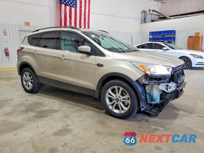 Czwarte zdjęcie samochodu z boku: 2017 FORD ESCAPE SE VIN:1FMCU9G96HUD53658 - miniatura