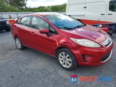 Czwarte zdjęcie samochodu z boku: 2011 FORD FIESTA SE VIN:3FADP4BJ1BM153275 - miniatura