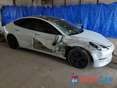 Czwarte zdjęcie samochodu z boku: 2023 TESLA MODEL 3 VIN:5YJ3E1EA7PF494357 - miniatura