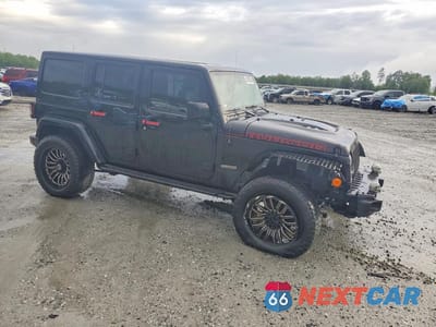 Czwarte zdjęcie samochodu z boku: 2017 JEEP WRANGLER UNLIMITED RUBICON VIN:1C4HJWFG6HL677104 - miniatura