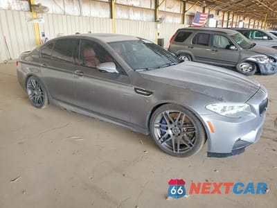 Czwarte zdjęcie samochodu z boku: 2013 BMW M5 VIN:WBSFV9C55DD096707 - miniatura