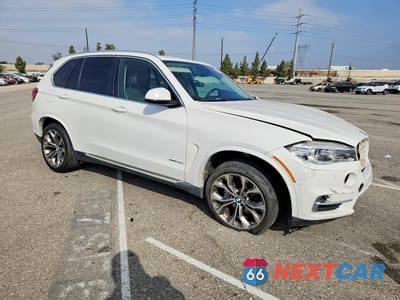 Czwarte zdjęcie samochodu z boku: 2014 BMW X5 SDRIVE35I VIN:5UXKR2C57E0H32250 - miniatura