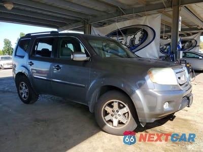 Czwarte zdjęcie samochodu z boku: 2011 HONDA PILOT TOURING VIN:5FNYF4H98BB009089 - miniatura