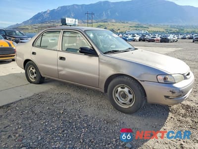 Czwarte zdjęcie samochodu z boku: 1999 TOYOTA COROLLA VE VIN:1NXBR12E6XZ242979 - miniatura