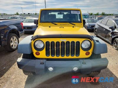 Piąte zdjęcie samochodu w środku: 2011 JEEP WRANGLER VIN:1J4GA2D11BL533223 - miniatura