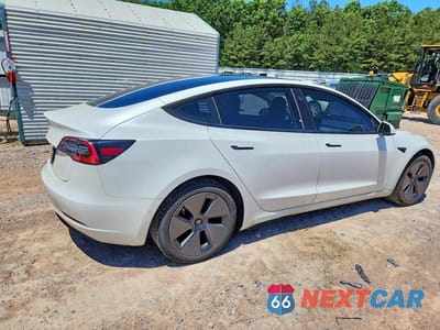Trzecie zdjęcie samochodu z tyłu: 2021 TESLA MODEL 3 VIN:5YJ3E1EAXMF919968 - miniatura