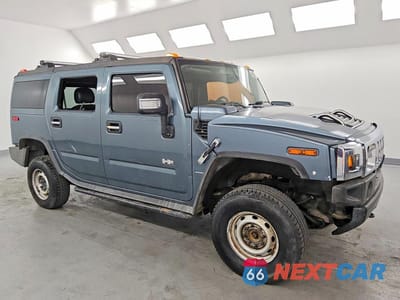 Czwarte zdjęcie samochodu z boku: 2005 HUMMER H2 VIN:5GRGN23U35H100787 - miniatura