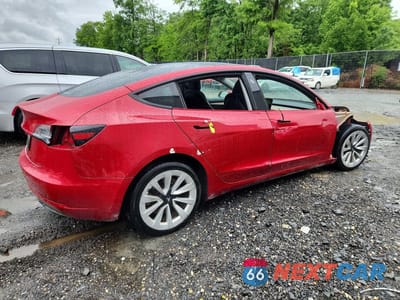 Trzecie zdjęcie samochodu z tyłu: 2023 TESLA MODEL 3 VIN:5YJ3E1EA4PF439008 - miniatura
