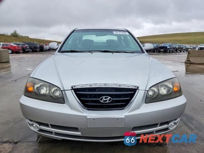 Piąte zdjęcie samochodu w środku: 2004 HYUNDAI ELANTRA GLS VIN:KMHDN46D34U712470 - miniatura