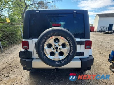 Zdjęcie 6 z 13 samochodu: 2015 JEEP WRANGLER UNLIMITED SAHARA VIN:1C4BJWEG0FL516400 - miniatura