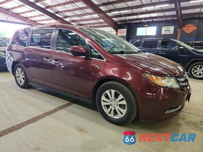 Czwarte zdjęcie samochodu z boku: 2016 HONDA ODYSSEY EXL VIN:5FNRL5H6XGB122655 - miniatura