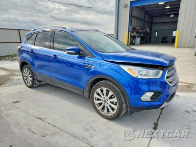 Czwarte zdjęcie samochodu z boku: 2017 FORD ESCAPE TITANIUM VIN:1FMCU0J90HUF10802 - miniatura