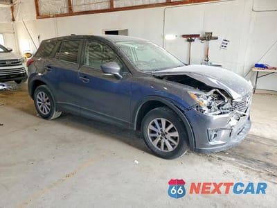 Czwarte zdjęcie samochodu z boku: 2014 MAZDA CX-5 TOURING VIN:JM3KE2CY4E0422195 - miniatura