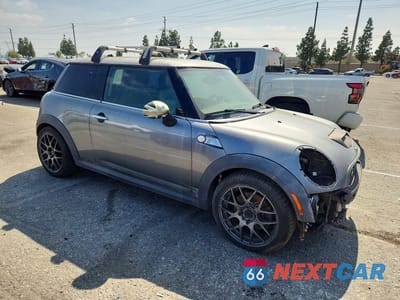 Czwarte zdjęcie samochodu z boku: 2010 MINI COOPER S VIN:WMWMF7C53ATZ73127 - miniatura