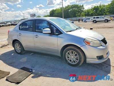 Czwarte zdjęcie samochodu z boku: 2013 SUZUKI SX4 LE VIN:JS2YC5A33D6100537 - miniatura