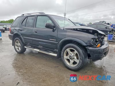 Czwarte zdjęcie samochodu z boku: 2002 ISUZU RODEO S VIN:4S2DM58W524326890 - miniatura