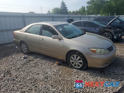 Czwarte zdjęcie samochodu z boku: 2002 TOYOTA CAMRY XLE V6 VIN:4T1BF30K42U503094 - miniatura