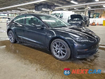 Czwarte zdjęcie samochodu z boku: 2022 TESLA MODEL 3 VIN:5YJ3E1EA4NF286191 - miniatura
