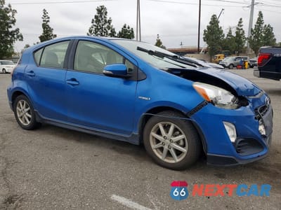Czwarte zdjęcie samochodu z boku: 2017 TOYOTA PRIUS C ONE VIN:JTDKDTB39H1595975 - miniatura