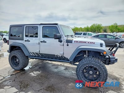 Czwarte zdjęcie samochodu z boku: 2015 JEEP WRANGLER UNLIMITED RUBICON VIN:1C4BJWFG6FL721895 - miniatura