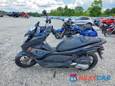 Trzecie zdjęcie samochodu z tyłu: 2013 HONDA PCX 150 VIN:MLHKF1210D5006454 - miniatura