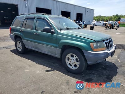 Czwarte zdjęcie samochodu z boku: 1999 JEEP GRAND CHEROKEE LAREDO VIN:1J4GW58S6XC569065 - miniatura