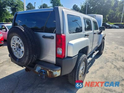 Czwarte zdjęcie samochodu z boku: 2010 HUMMER H3 VIN:5GTMNGEE2A8117820 - miniatura