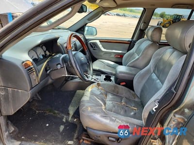 Zdjęcie 7 z 12 samochodu: 2002 JEEP GRAND CHEROKEE VIN:1J8GW68J12C206709 - miniatura