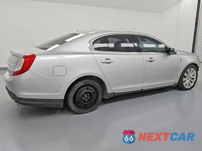 Trzecie zdjęcie samochodu z tyłu: 2015 LINCOLN MKS VIN:1LNHL9FT1FG607990 - miniatura