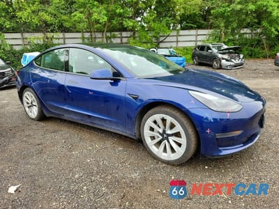 Czwarte zdjęcie samochodu z boku: 2022 TESLA MODEL 3 VIN:5YJ3E1EA3NF370499 - miniatura