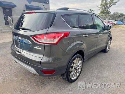 Trzecie zdjęcie samochodu z tyłu: 2016 FORD ESCAPE SE VIN:1FMCU0GX4GUC35892 - miniatura