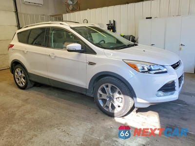 Czwarte zdjęcie samochodu z boku: 2016 FORD ESCAPE TITANIUM VIN:1FMCU9JX0GUB85277 - miniatura