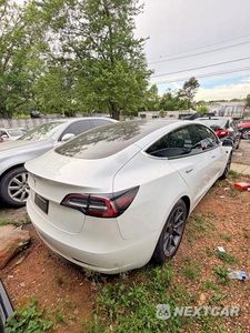 Czwarte zdjęcie samochodu z boku: 2020 TESLA MODEL 3 VIN:5YJ3E1EA4LF797316 - miniatura