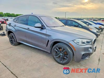 Czwarte zdjęcie samochodu z boku: 2019 BMW X6 SDRIVE35I VIN:5UXKU0C59K0S97436 - miniatura