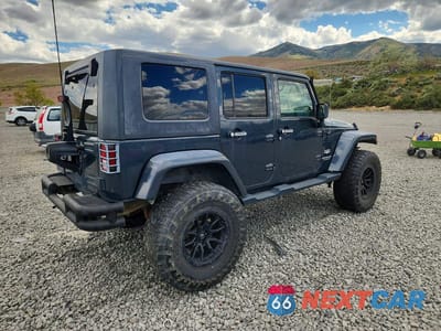 Trzecie zdjęcie samochodu z tyłu: 2007 JEEP WRANGLER SAHARA VIN:1J4GA59167L123079 - miniatura