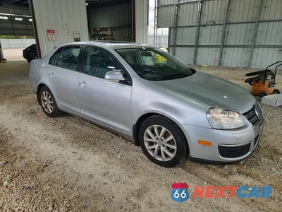 Czwarte zdjęcie samochodu z boku: 2010 VOLKSWAGEN JETTA SE VIN:3VWRX7AJ9AM164541 - miniatura