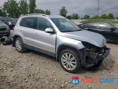 Czwarte zdjęcie samochodu z boku: 2014 VOLKSWAGEN TIGUAN S VIN:WVGBV3AX0EW580132 - miniatura