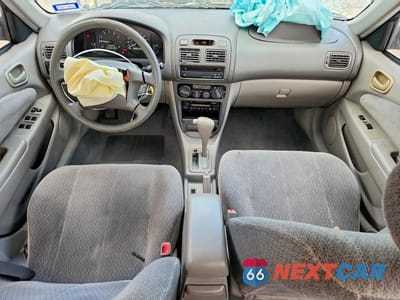 Zdjęcie 8 z 12 samochodu: 2001 TOYOTA COROLLA LE VIN:1NXBR12E51Z542648 - miniatura