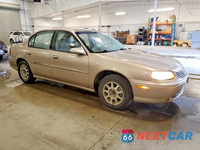 Czwarte zdjęcie samochodu z boku: 1998 CHEVROLET MALIBU LS VIN:1G1NE52M4W6196589 - miniatura