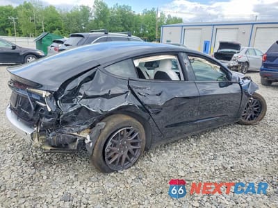 Trzecie zdjęcie samochodu z tyłu: 2024 TESLA MODEL 3 VIN:5YJ3E1EB2RF822019 - miniatura