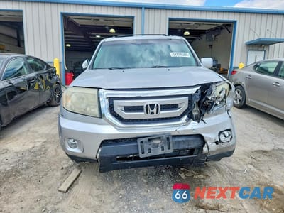Piąte zdjęcie samochodu w środku: 2011 HONDA PILOT TOURING VIN:5FNYF4H94BB056698 - miniatura
