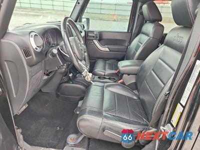 Zdjęcie 7 z 14 samochodu: 2012 JEEP WRANGLER UNLIMITED SAHARA VIN:1C4BJWEG8CL184802 - miniatura
